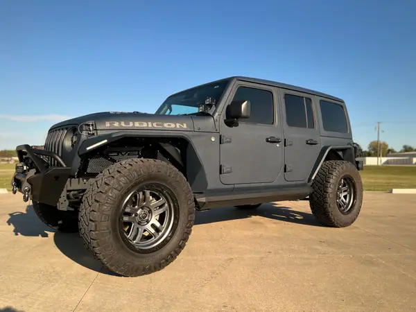 Grey Jeep Wrangler Rubicon after ceramic coating, parked in evening sun