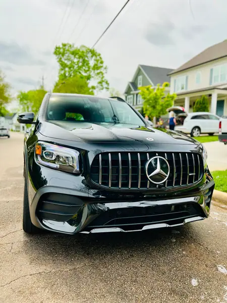 Black Mercedes-AMG GLB, front view, after a mobile detail